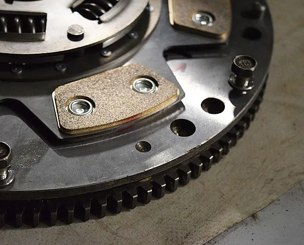 Vehicle on lift during flywheel and clutch inspection