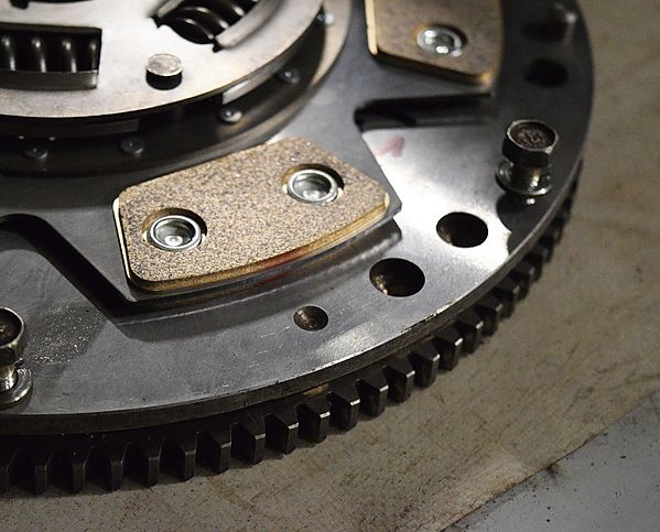 Vehicle on lift during flywheel and clutch inspection